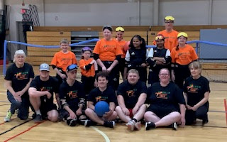 Group photo of 2025 MOBALE Summer Sports Education Camp participants, including athletes, counselors, and volunteers gathered together